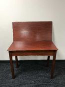 A mahogany turn over top tea table