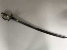 A 19th century hunting sword or hanger, probably German, with 68cm curved and etched blade,