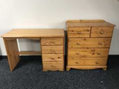A pine desk fitted four drawers together with a pine five-drawer chest