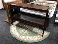 A mahogany two-tier dumb waiter,