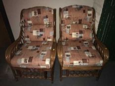 A pair of bamboo conservatory armchairs