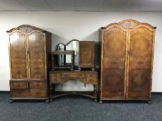 An early 20th century six-piece figured walnut bedroom suite comprising of lady's and gent's