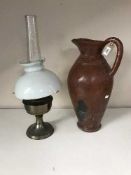 An early 20th century oil lamp with chimney and shade,