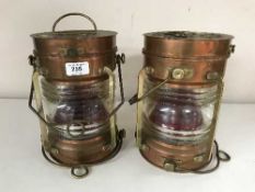 A pair of copper and brass ships lamps