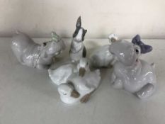 Five Lladro animal figures - Hippo with green frog on nose, Hippo with purple bow,