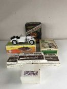 A box of Jack Daniels Texas Holdem set, five boxed horse shoe gun racks,