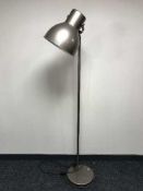 A contemporary metal adjustable floor lamp