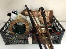 A box containing woollen hearth rug, miniature mannequin on stand, walking sticks,