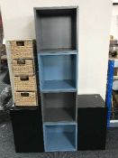 A pair of black high gloss stands together with a metal and wicker four drawer chest and four Ikea