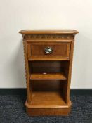 A set of narrow inlaid yewwood shelves fitted a drawer
