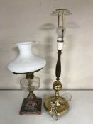 An antique oil lamp on a copper base,