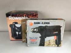 A boxed Black and Decker hammer drill,