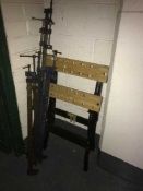 A folding work bench and six sash clamps