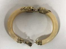 A 1920's two-piece ivory bangle,