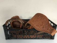 Assorted tooled leather horse tack and stirrups