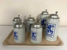Six LowenBrau lidded tankards