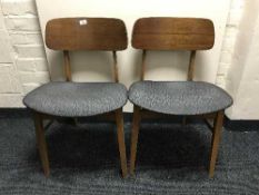 Four teak Beautility dining chairs