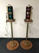 A pair of brass ships lamps on stands, stamped Perko,