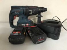 A box of 36v professional hammer drill with batteries and chargers