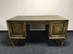 A continental oak twin pedestal partners desk