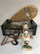 A vintage hammock, wooden totem pole,