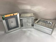 A contemporary mirrored all-glass jewellery box,