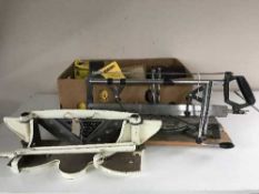 A Draper mitre saw, an Aptc mitre trimmer and a box of assorted steel wool, sand paper,