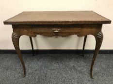 A continental oak side table fitted a drawer,