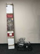 A boxed fibre-optic floor standing tree together with a basket containing a set of graduated boxes,