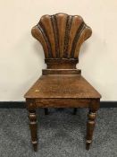 A Victorian oak hall seat