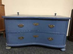 An antique painted oak serpentine fronted two drawer-chest