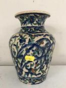 An early 20th century terracotta glazed vase with floral decoration