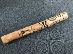 A carved pine totem pole