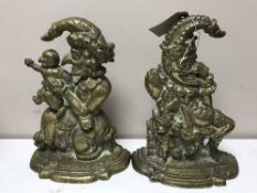 A pair of brass Punch & Judy door stops