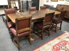 An early 20th century carved oak eight piece dining room suite (8)
