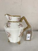 A Beleek jug decorated with pink flowers and gilding,