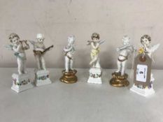 Six Italian china figures of cherubs with musical instruments