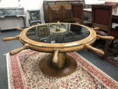 An impressive revolving ship's wheel table, diameter 154 cm.