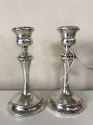 A pair of silver candlesticks,