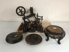 A tray containing wooden pieces including miniature spinning wheel, folding hardwood table,