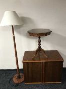 A teak effect double door cabinet together with an Italianate wine table and a teak G Plan standard