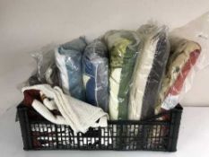 A quantity of assorted cushions depicting animals and a Budweiser sleeping bag