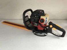 A Homelite petrol hedge trimmer