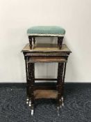 A nest of three mahogany tables and an Edwardian footstool