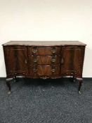 A mahogany Queen Anne style serpentine fronted sideboard