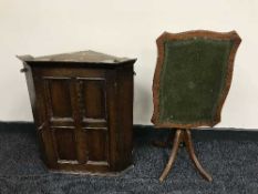A late Victorian oak hanging corner cabinet and a folding leather topped table