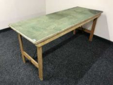 A mid 20th century folding trestle table