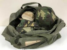 A holdall containing assorted DP army clothing and bags