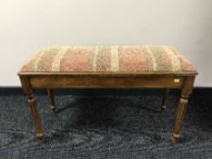 A piano storage duet stool