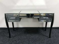 A glass mirrored dressing table fitted with two drawers and stool